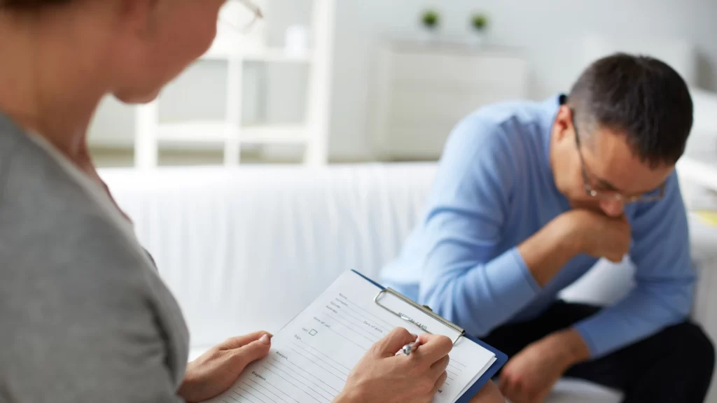 man talking to a mental health therapist
