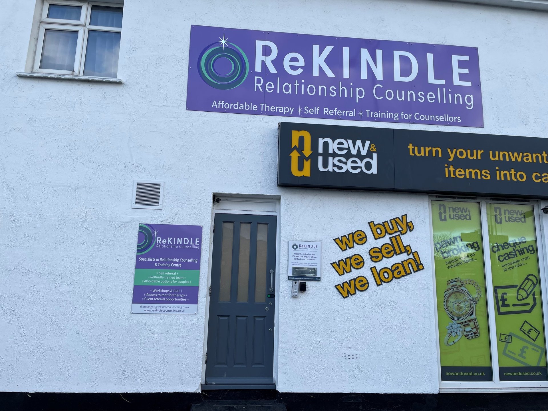 Grey front door under the purple ReKindle Counselling sign at 327 Bridgwater Drive, Westcliff-on-Sea, where Keeley Smith practises hypnotherapy.