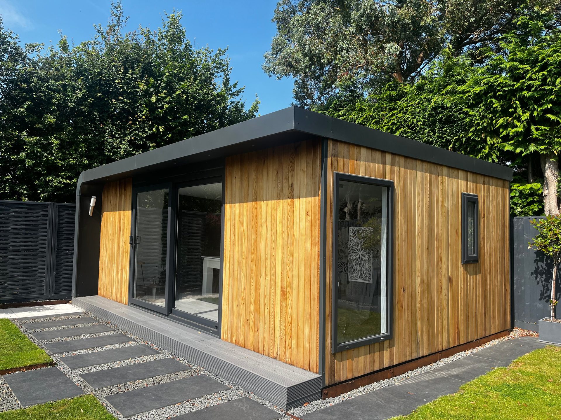 Modern wooden garden therapy room with large glass doors, where Marina Love sees clients near Aylesbury.